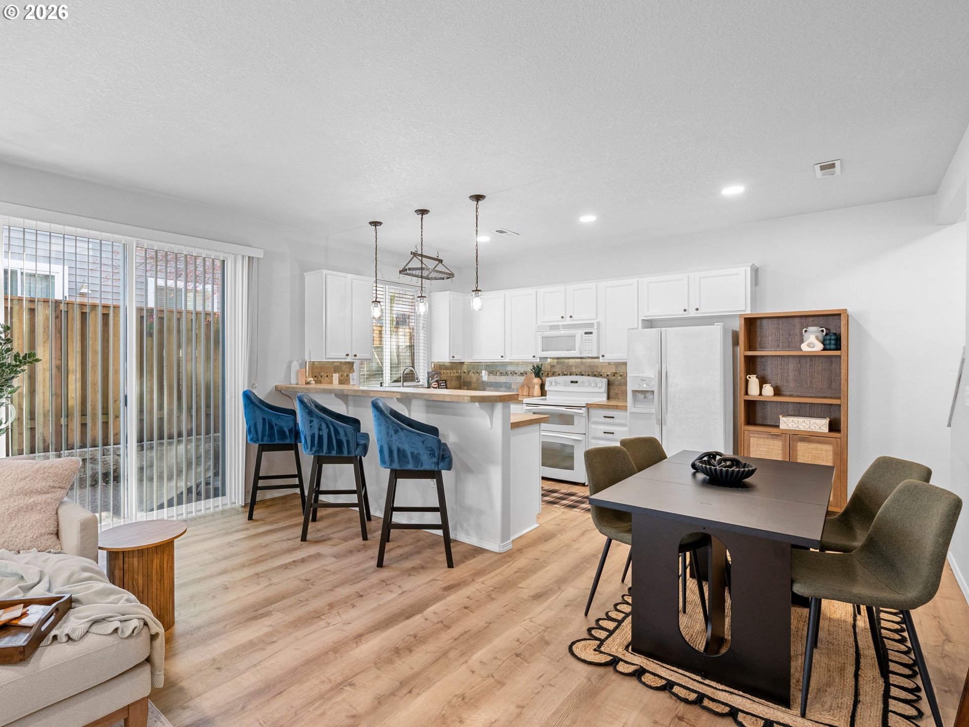 6225 Southwest 182nd Terrace Beaverton, OR 97007 - Photo 9 of 36 a view of a dining room with furniture and wooden floor