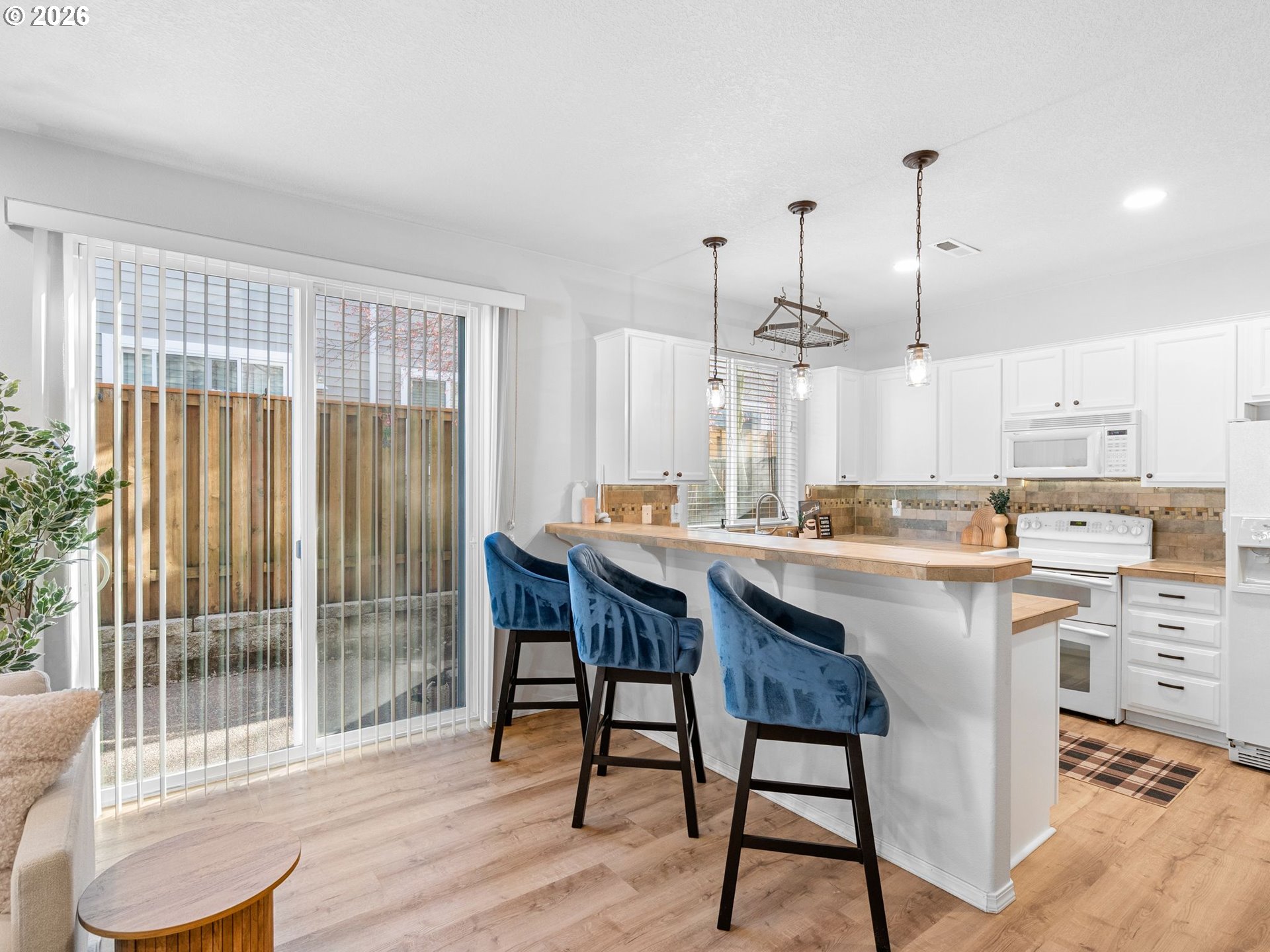6225 Southwest 182nd Terrace Beaverton, OR 97007 - Photo 10 of 36 a kitchen with a table and chairs