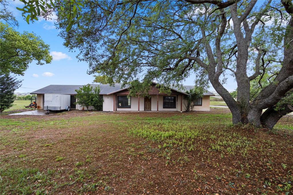 17425 Lake Ingram Road Winter Garden, FL 34787 - Photo 2 of 38 a view of a house with a yard