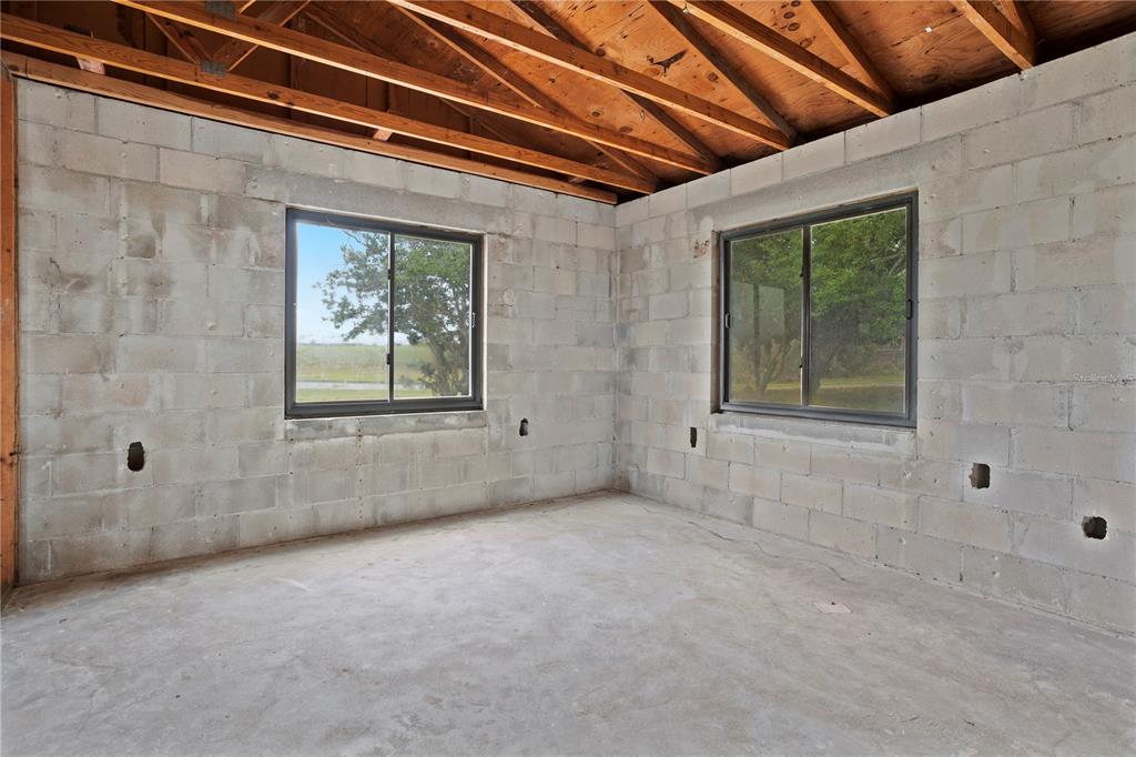 17425 Lake Ingram Road Winter Garden, FL 34787 - Photo 26 of 38 a view of an empty room with windows