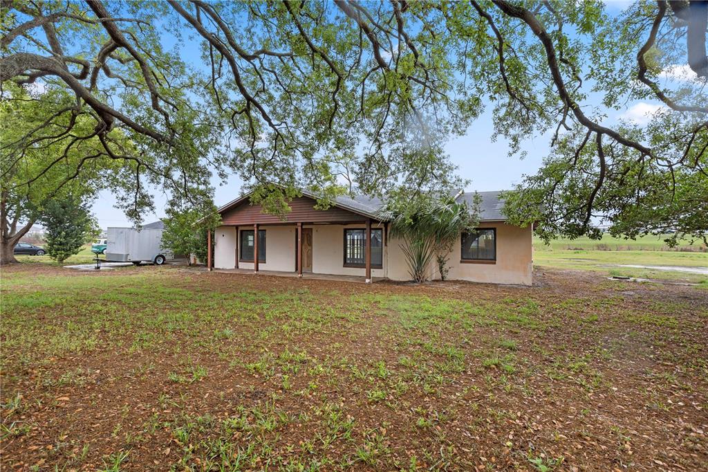 17425 Lake Ingram Road Winter Garden, FL 34787 - Photo 3 of 38 a front view of a house with garden