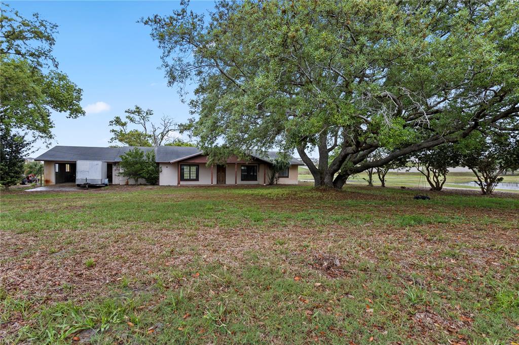 17425 Lake Ingram Road Winter Garden, FL 34787 - Photo 4 of 38 a front view of a house with a yard