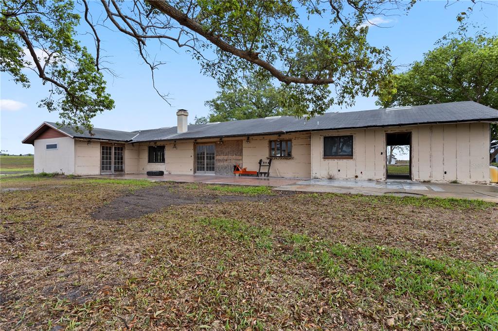 17425 Lake Ingram Road Winter Garden, FL 34787 - Photo 5 of 38 a front view of a house with yard and porch