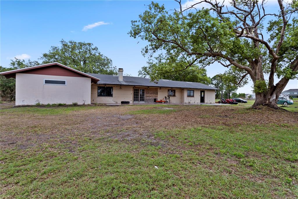 17425 Lake Ingram Road Winter Garden, FL 34787 - Photo 6 of 38 a front view of house with yard and trees