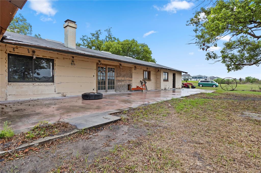 17425 Lake Ingram Road Winter Garden, FL 34787 - Photo 7 of 38 a view of a house with backyard and trees