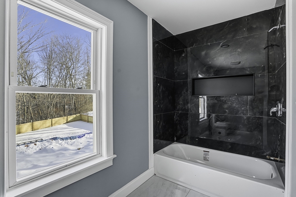 140 Spring Street Athol, MA 01331 - Photo 29 of 42 a bathroom with a bathtub and a shower