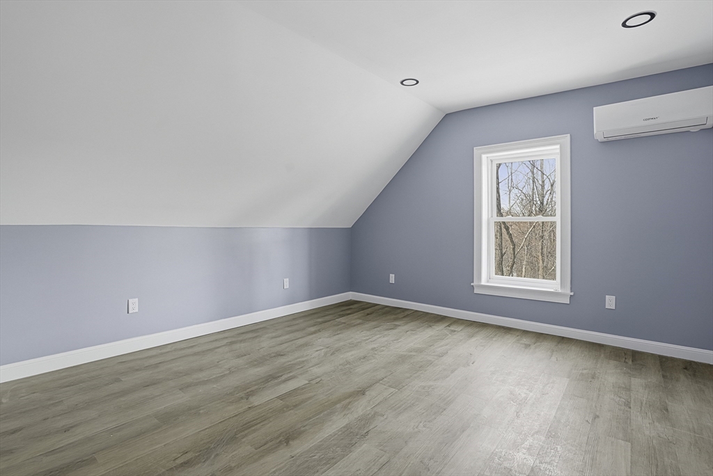 140 Spring Street Athol, MA 01331 - Photo 34 of 42 a view of an empty room with wooden floor and a window