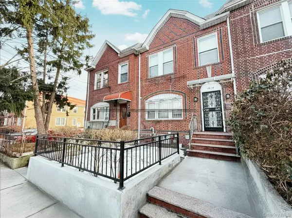 a view of room with window and wooden floor