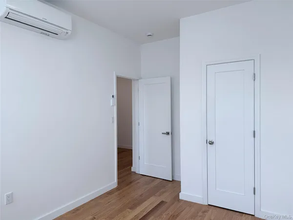 a bathroom with a toilet sink vanity and shower
