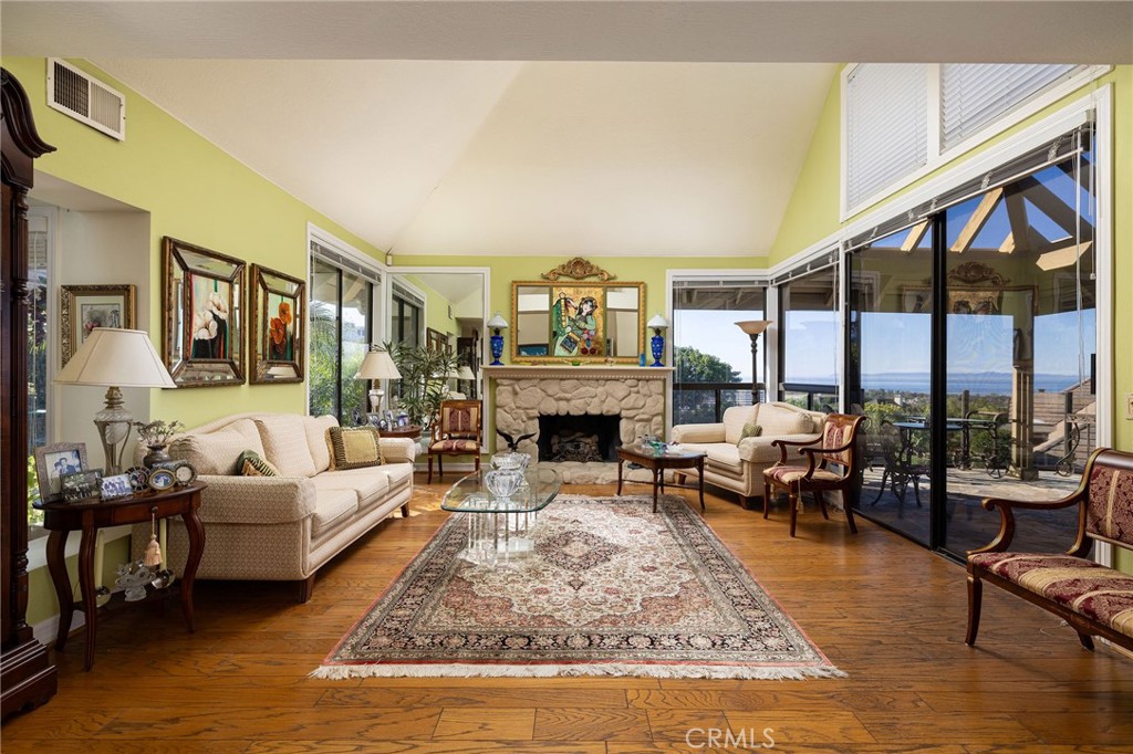 39 Harbor Ridge Drive Newport Beach, CA 92660 - Photo 12 of 53 a living room with furniture large window and a fireplace