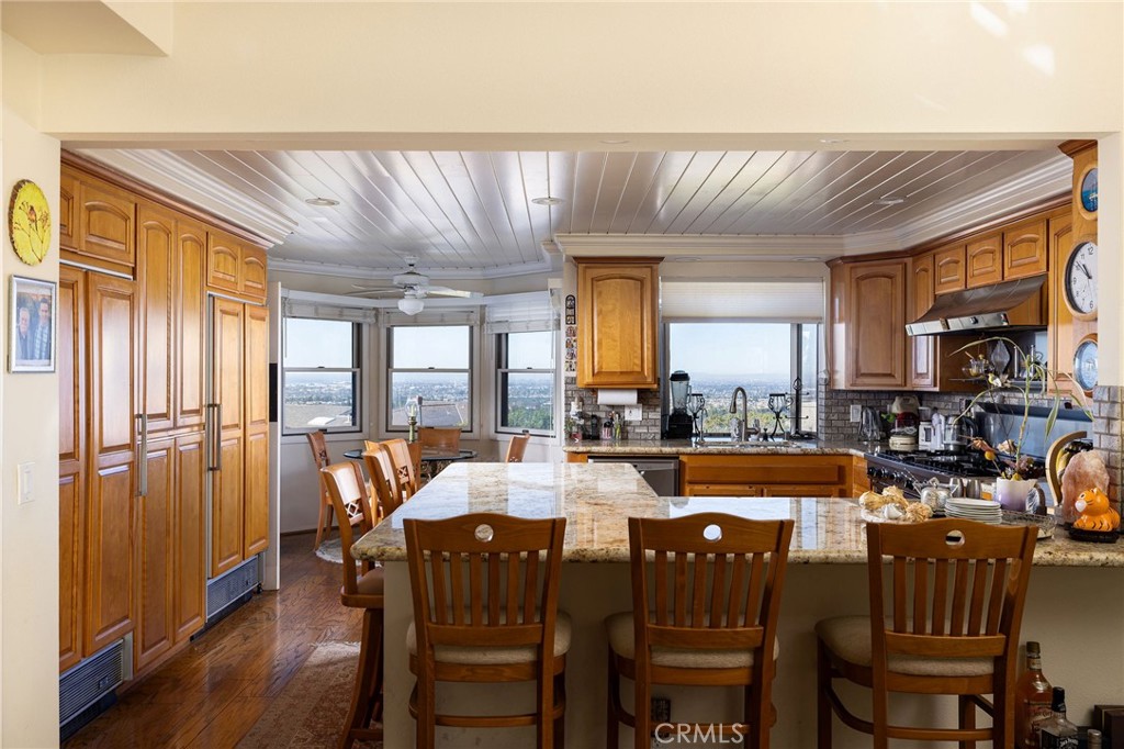 39 Harbor Ridge Drive Newport Beach, CA 92660 - Photo 16 of 53 a dining room with furniture a floor to ceiling window and wooden floor