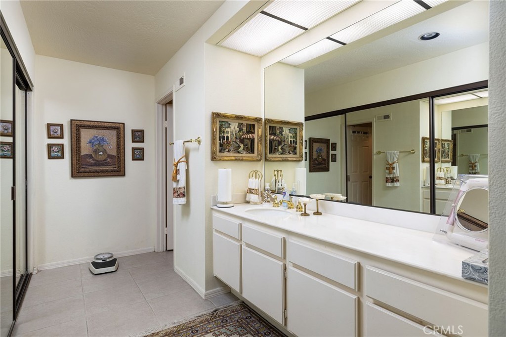39 Harbor Ridge Drive Newport Beach, CA 92660 - Photo 30 of 53 a bathroom with a double vanity sink a mirror and a shower