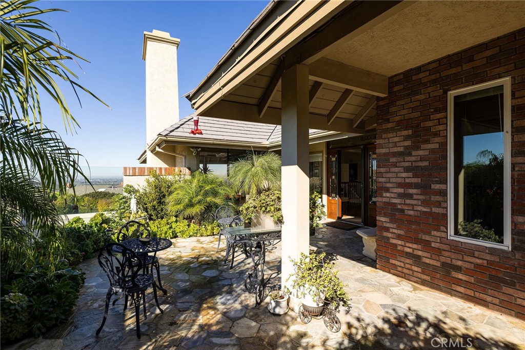 39 Harbor Ridge Drive Newport Beach, CA 92660 - Photo 33 of 53 a yellow and red umbrella in front of brick house