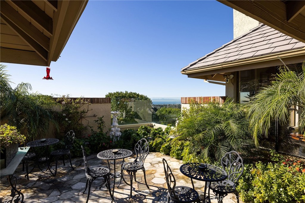 39 Harbor Ridge Drive Newport Beach, CA 92660 - Photo 35 of 53 a view of a patio with table and chairs and potted plants