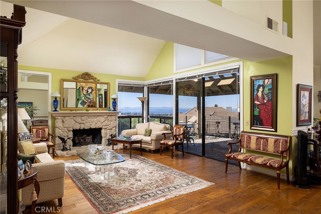 39 Harbor Ridge Drive Newport Beach, CA 92660 - Photo 6 of 53 a living room with furniture and a fireplace