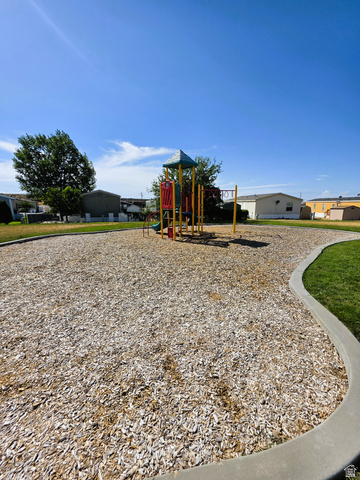 1604 180 East Tooele, UT 84074 - Photo 15 of 16 Community playground featuring a multi-level structure with slides and swings