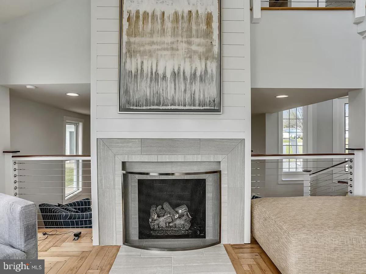 21642 Chicken Point Road Tilghman, MD 21671 - Photo 12 of 63 a living room with furniture and a fireplace