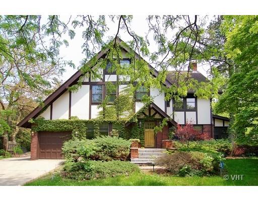 300 Sunset Road Winnetka, IL 60093 - Photo 1 of 1 a view of a house in front of a yard with plants and large trees