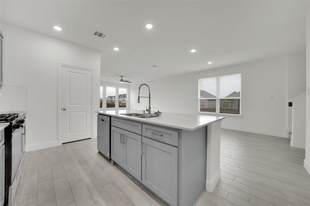 2901 Isla Terrace Princeton, TX 75407 - Photo 11 of 33 a bathroom with a sink and a mirror