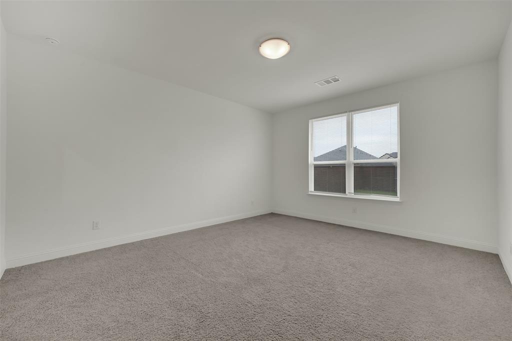 2901 Isla Terrace Princeton, TX 75407 - Photo 17 of 33 an empty room with windows
