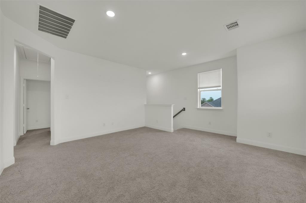 2901 Isla Terrace Princeton, TX 75407 - Photo 23 of 33 an empty room with windows