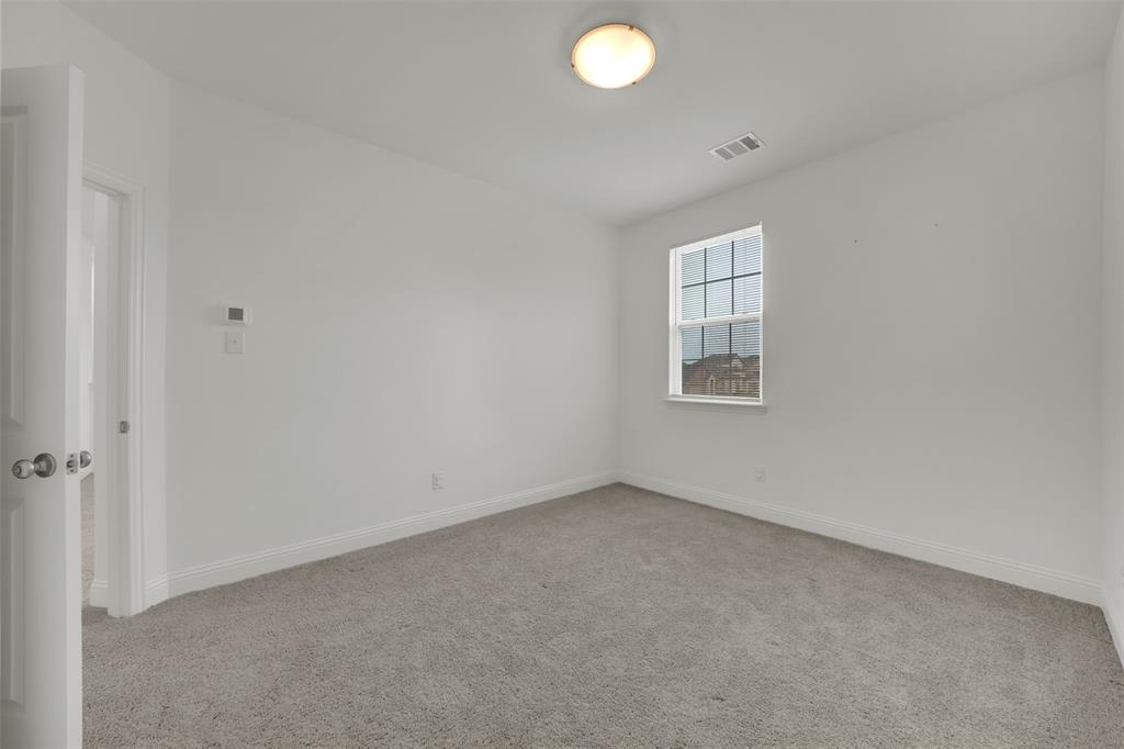 2901 Isla Terrace Princeton, TX 75407 - Photo 25 of 33 an empty room with windows