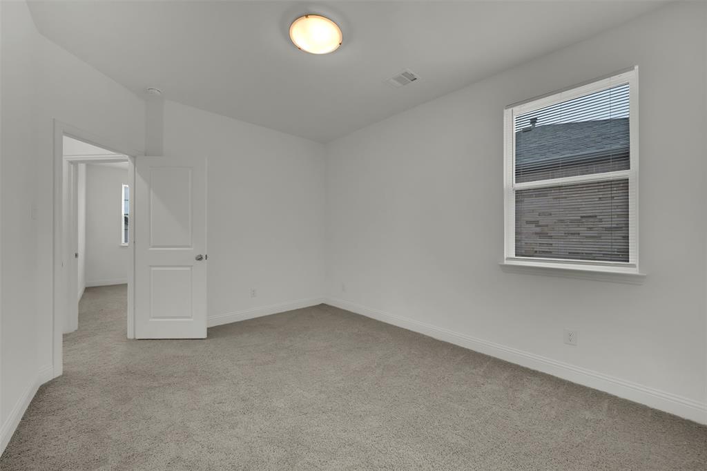 2901 Isla Terrace Princeton, TX 75407 - Photo 26 of 33 an empty room with windows