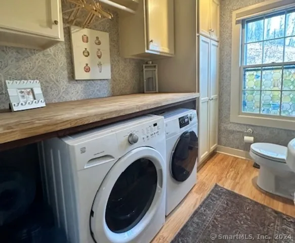 a view of a bedroom with washer and dryer