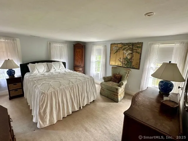 a bed room with a bed and a couch