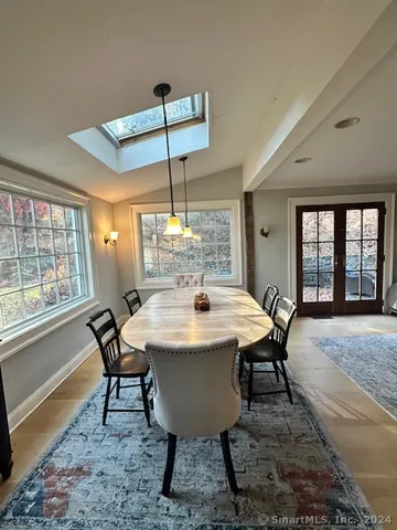 a view of a dining room with furniture window and outside view