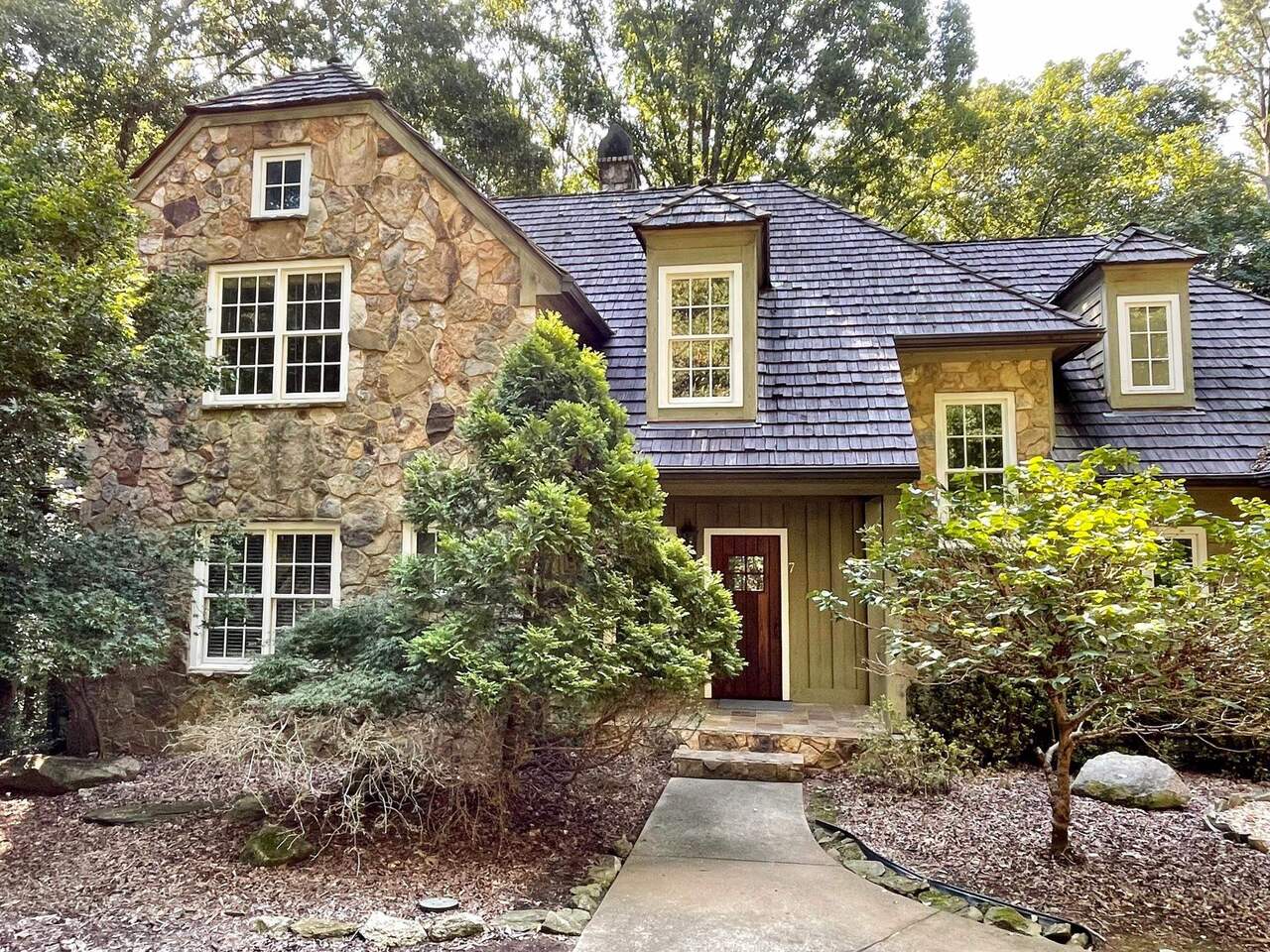 7 River Ridge Drive Athens, GA 30606 - Photo 1 of 1 a front view of a house with garden