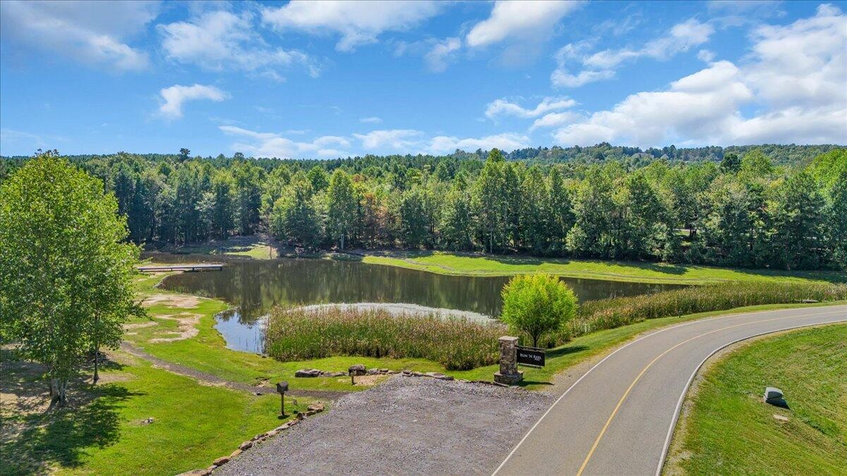 260 Compass Drive Jasper, TN 37347 - Photo 16 of 77 a view of a lake with a yard