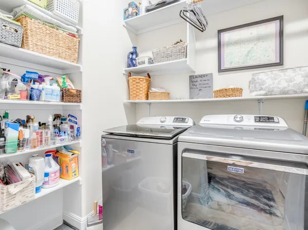 a utility room with washer and dryer