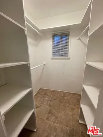 a view of an empty room with white walls