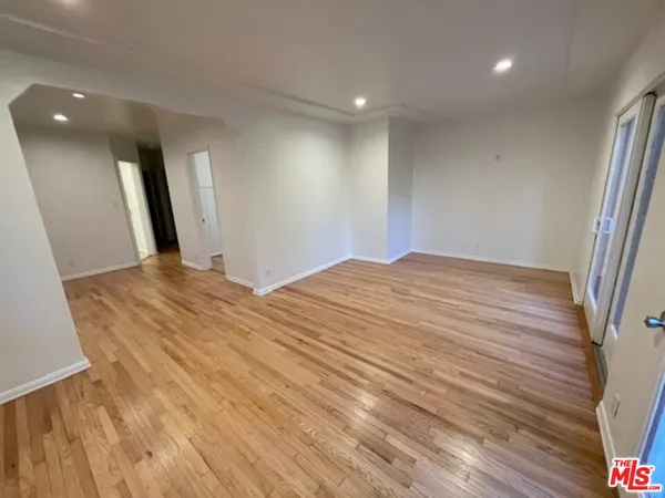 a bedroom with a bed and a mirror