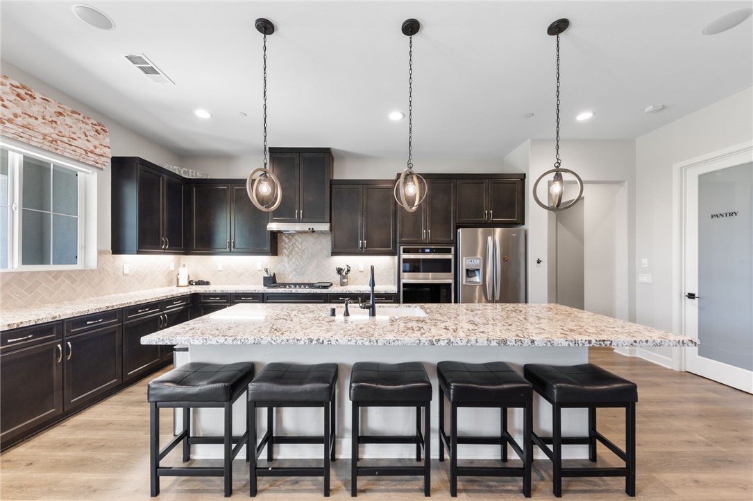 7631 Capstone Court Riverside, CA 92506 - Photo 10 of 39 Stunning cook’s kitchen with an oversized center island.
