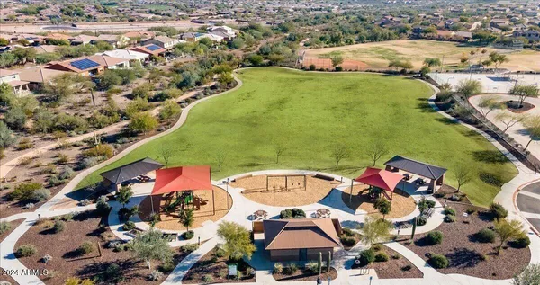 an aerial view of a house with a yard and garden