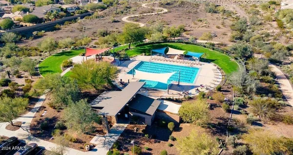 an aerial view of a house with a yard and garden
