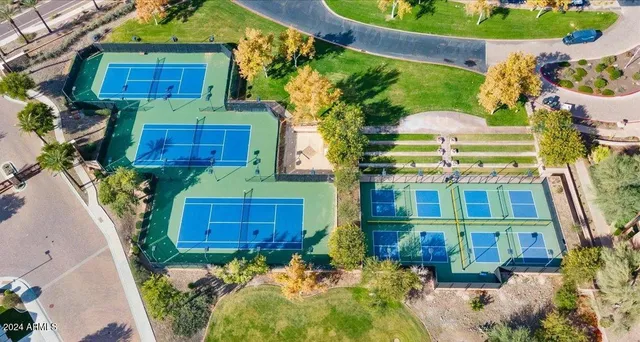 a aerial view of a house with a yard and garden