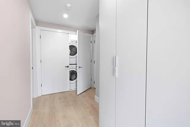 a view of a utility room with mirror