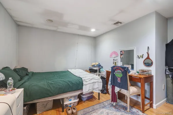 a bedroom with furniture and a bed