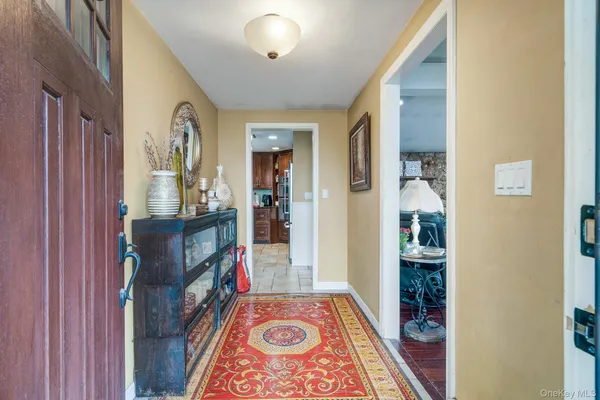 a view of an entryway with wooden floor