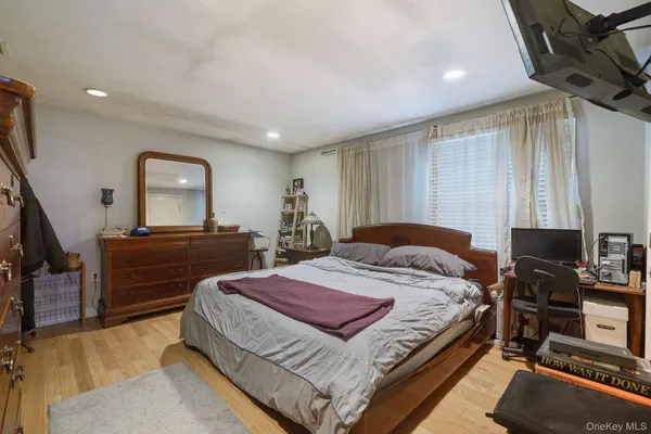 a bed room with a bed and a television