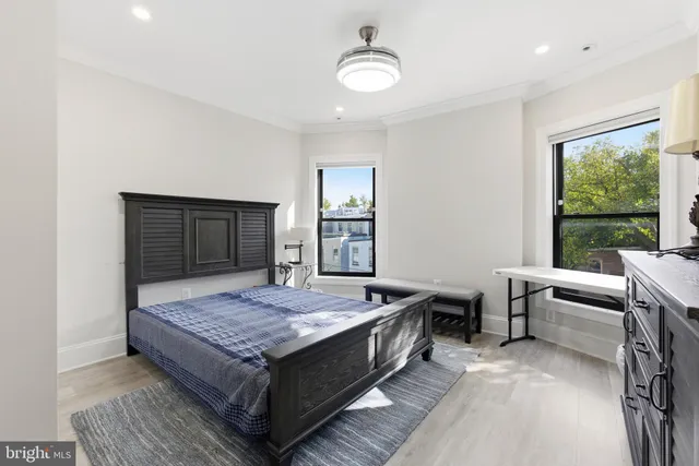 a brick building with a bench in front of it