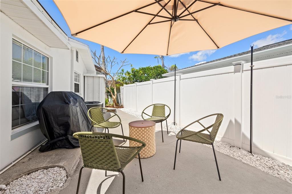 11225 2nd Street East, Unit A Treasure Island, FL 33706 - Photo 23 of 25 a view of a dining room with furniture and chandelier