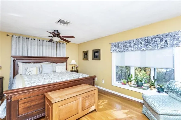 a bedroom with a bed and window