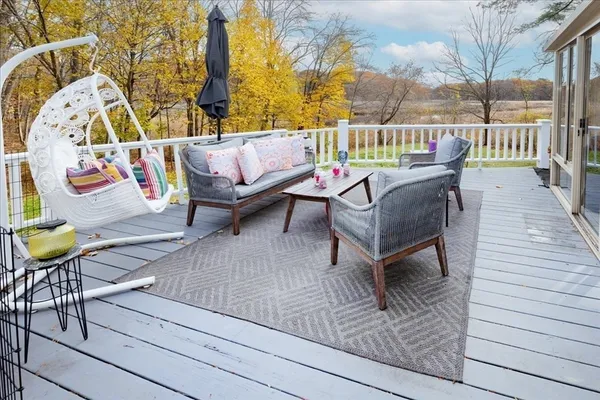 a outdoor space with patio the couches and a dining table with garden view