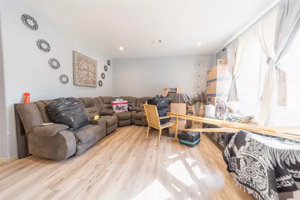a view of a living room and hardwood floor