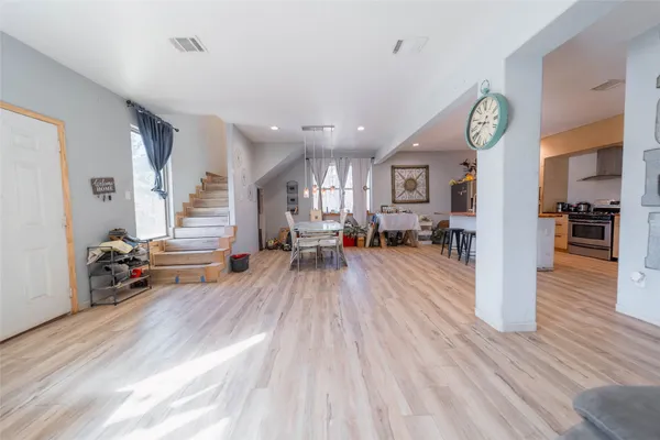 a view of a dining room with furniture window and wooden floor