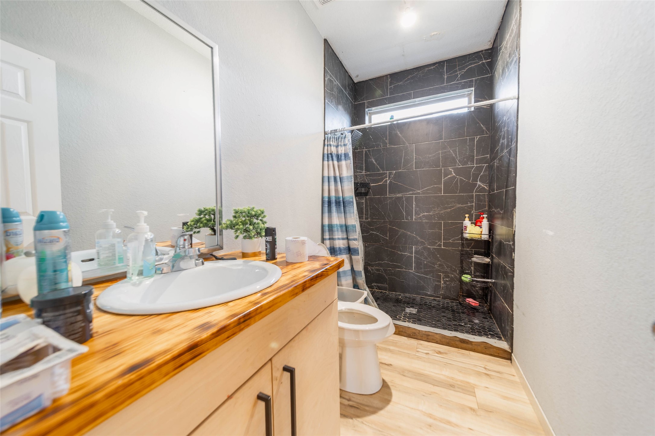 11 Seth Cleveland, TX 77328 - Photo 18 of 50 a bathroom with a sink and a mirror